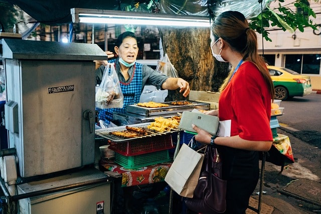 man selling Barbecue by the road side