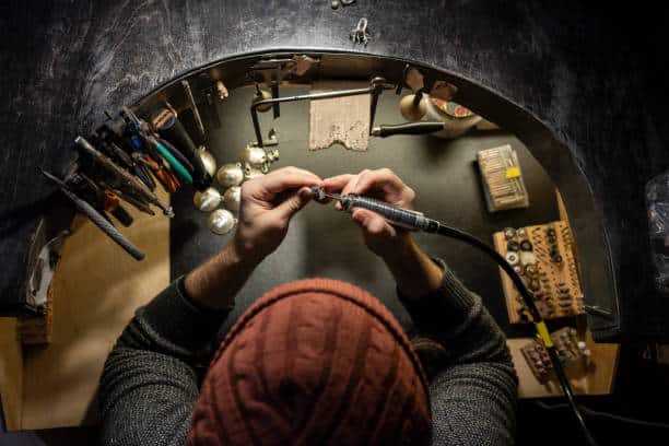 man making home Decorations with wood