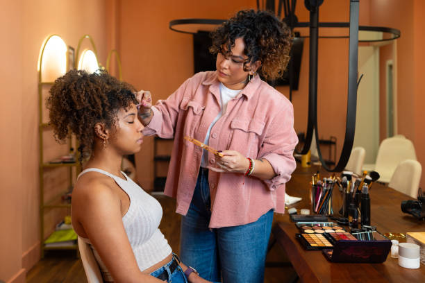 woman doing a client makeup 